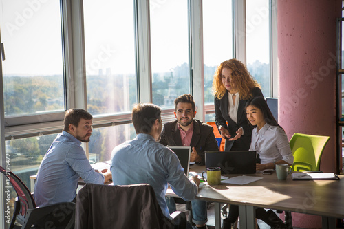 Fotografía Business people listening to one of their colleague bad or good news for their company, enterprise or firm while working round table in board room in office