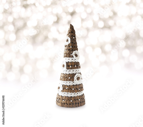 Christmas tree made of coffe beans isolated on white. Background of Christmas decorations.