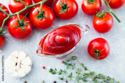 Tomato ketchup sauce with garlic, spices and herbs with cherry t
