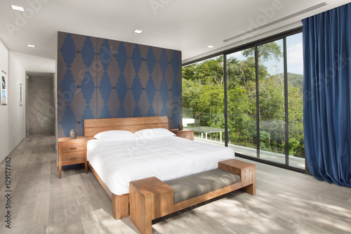 Panoramic view of nice white stylish modern bedroom