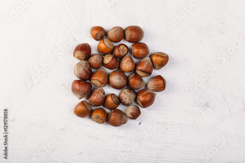 hazelnut kernel on a white texture table