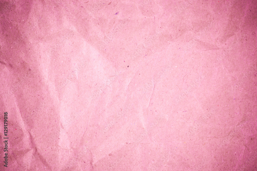 Fototapeta premium Pink crumpled recycle paper background.