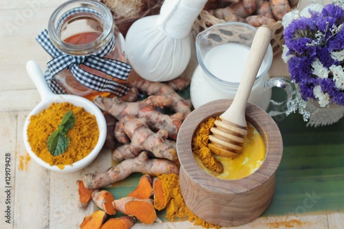 Turmeric powder with honey and milk for scrub.