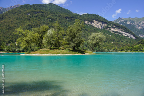 Crystal clear alpine lake in Italy . © steuccio79