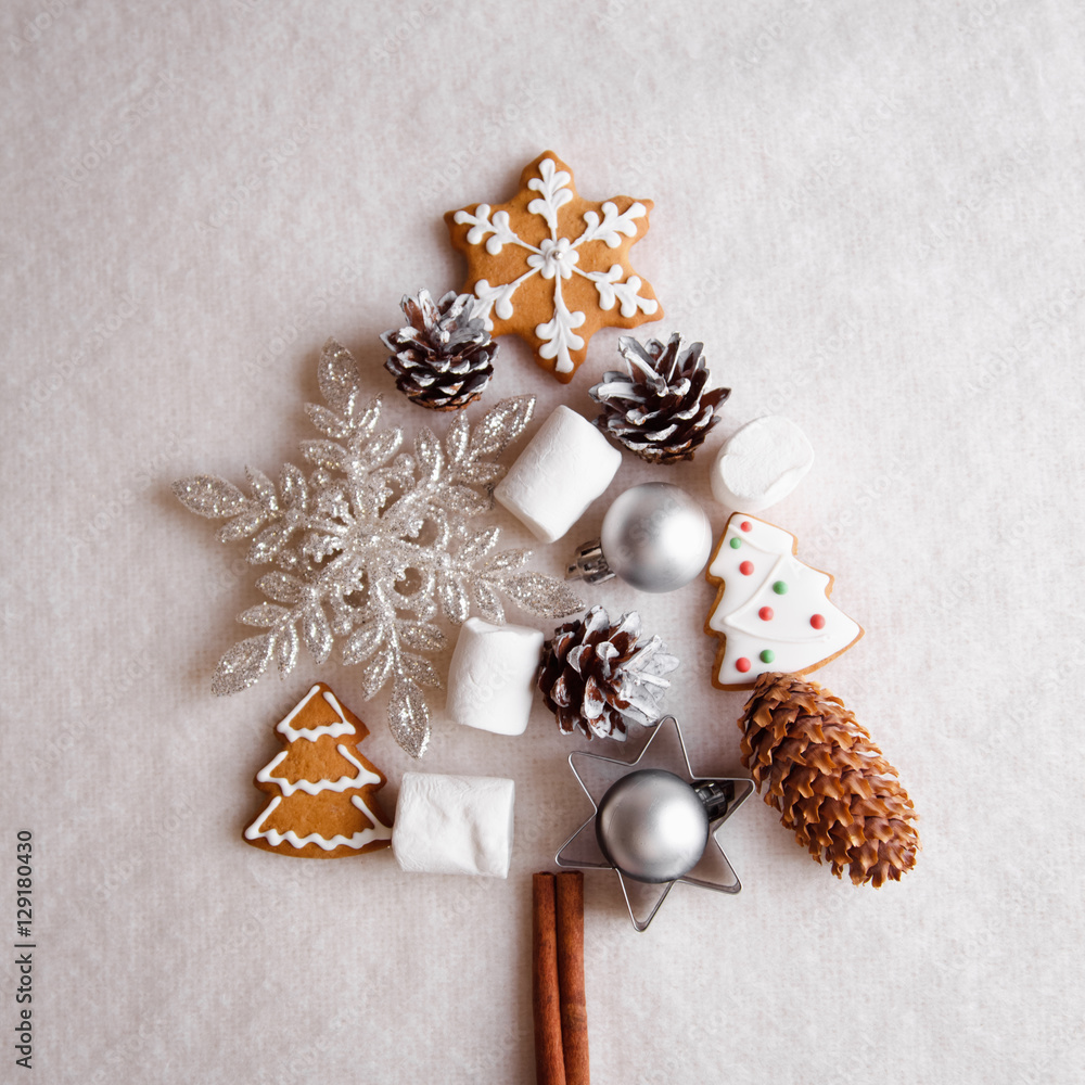 Beautiful Christmas tree made of gingerbread, marshmallows and Christmas decoration on light background Beautiful Christmas tree made of gingerbread, marshmallows and Christmas decoration on light background