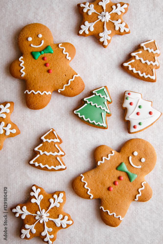 beautiful Christmas background with gingerbread men, Christmas trees and snowflakes with pine cones beautiful Christmas background with gingerbread men, Christmas trees and snowflakes with pine cones