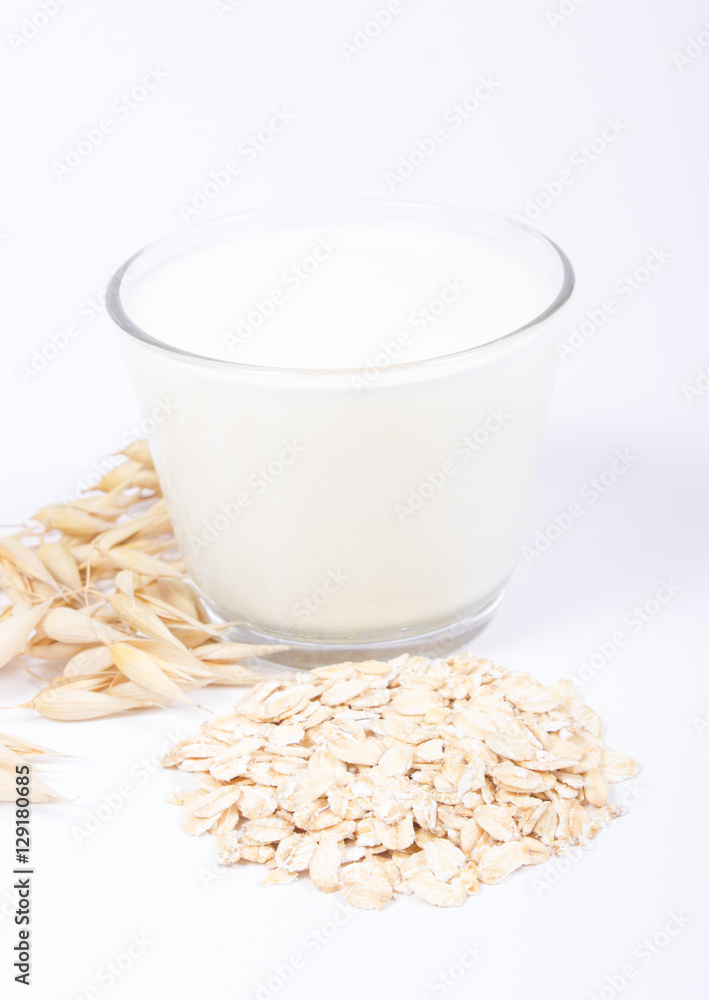Oat milk, the concept of a vegetarian diet. White background. Oat milk, the concept of a vegetarian diet. White background.