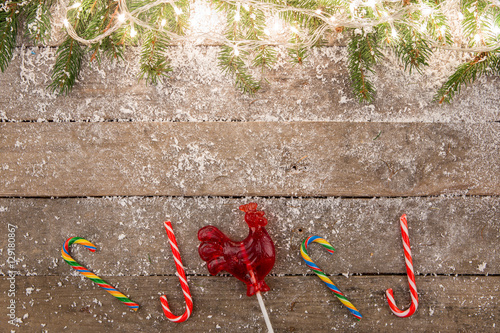 christmas decorations with snow on the wooden background
