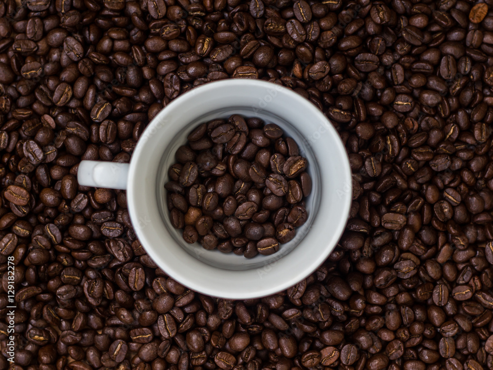 Coffee beans in a cup,cup of coffee with beans Coffee beans in a cup,cup of coffee with beans
