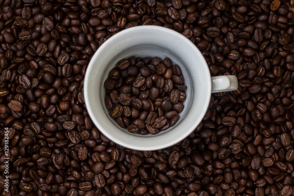 Coffee beans in a cup,cup of coffee with beans Coffee beans in a cup,cup of coffee with beans