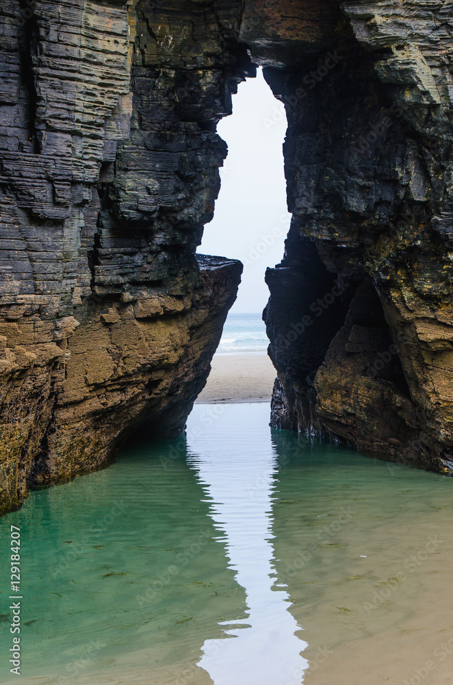 Natural arch in the rock of the cliffs in Ribadeo