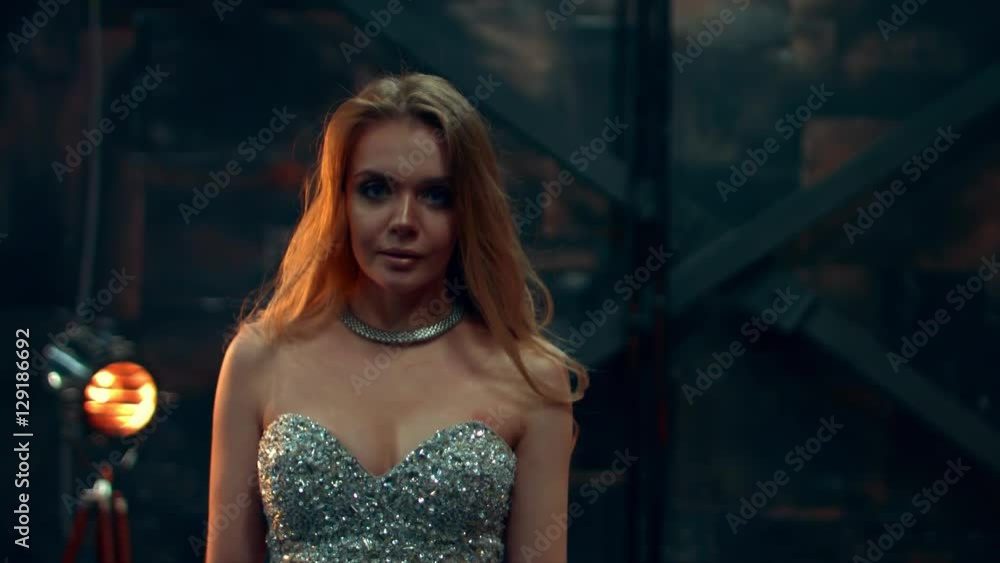 Girl in a luxurious dress goes towards the camera Girl in a luxurious dress goes towards the camera