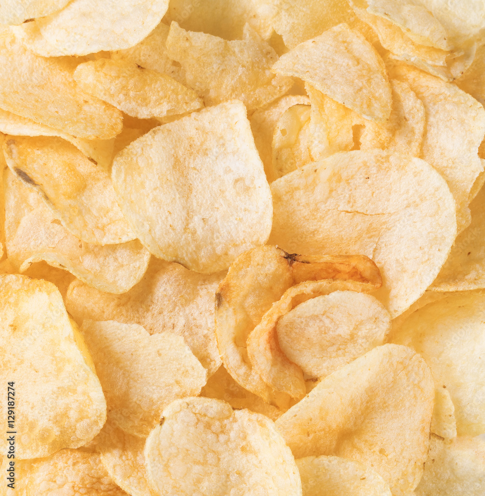 Filled frame of crunchy fresh potato chips Filled frame of crunchy fresh potato chips