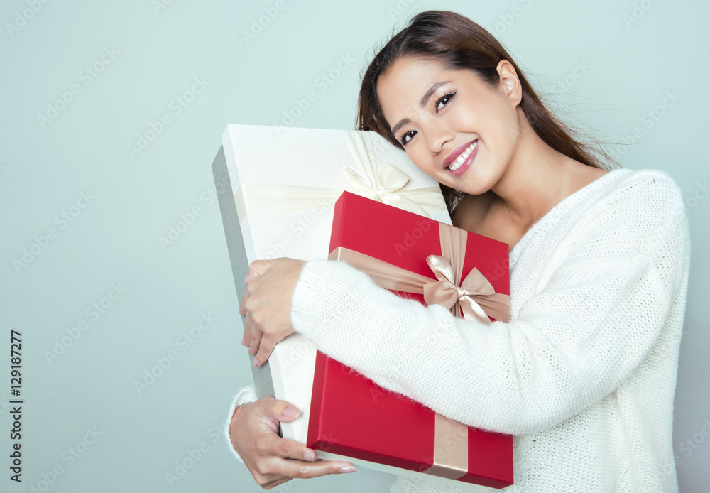 beautiful young asian woman holding present beautiful young asian woman holding present