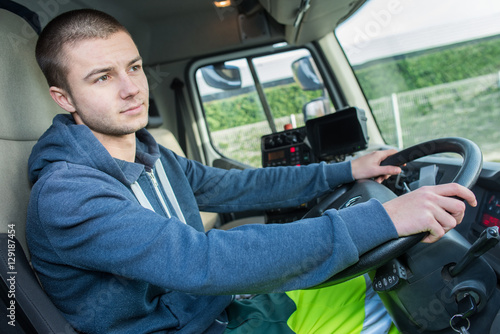Young man driving lorry