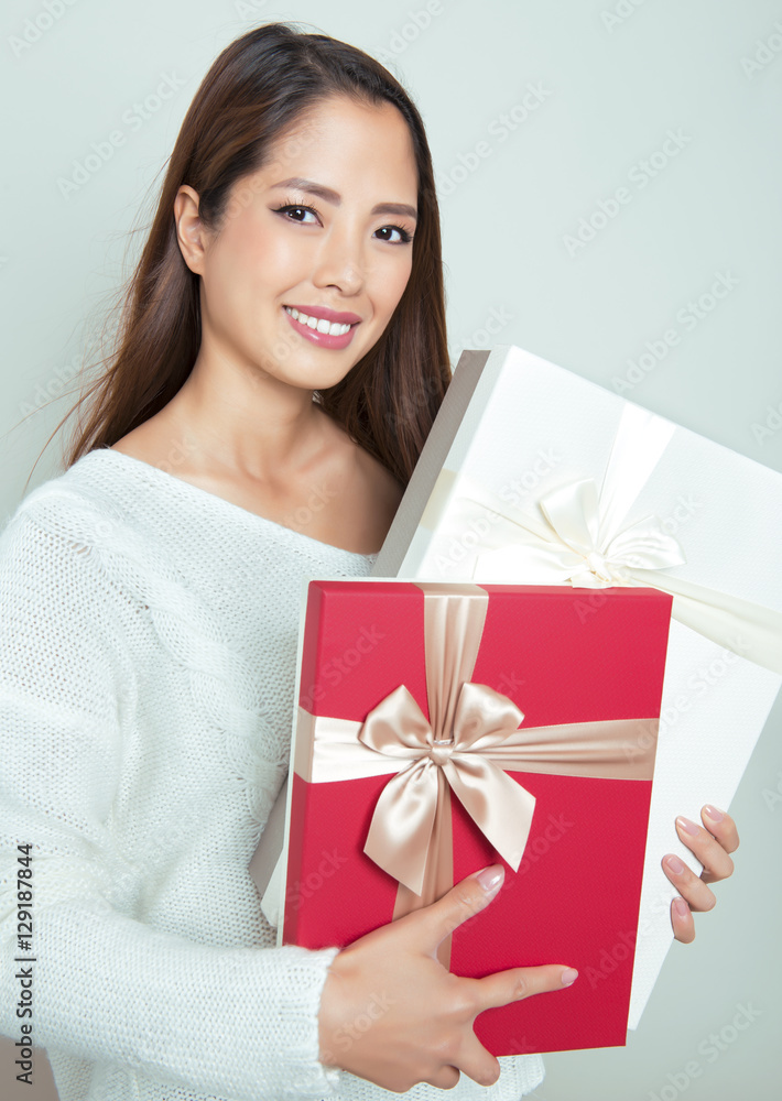 beautiful young asian woman holding present beautiful young asian woman holding present