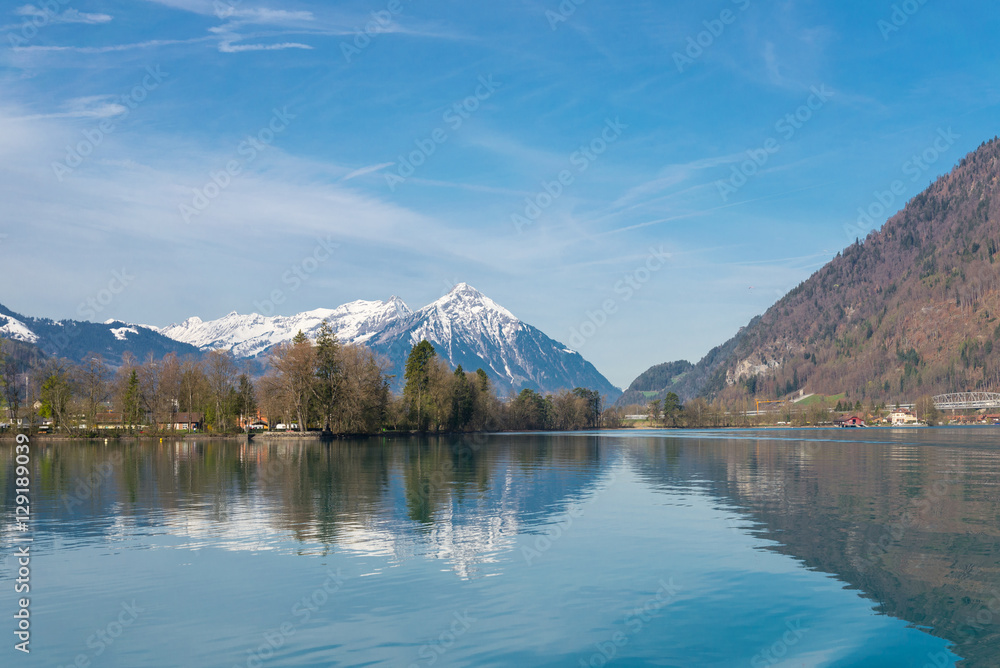 Reflection of Alps on the Brienz lake in Interlaken, Switzerland
