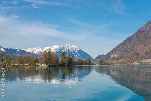 Reflection of Alps on the Brienz lake in Interlaken, Switzerland