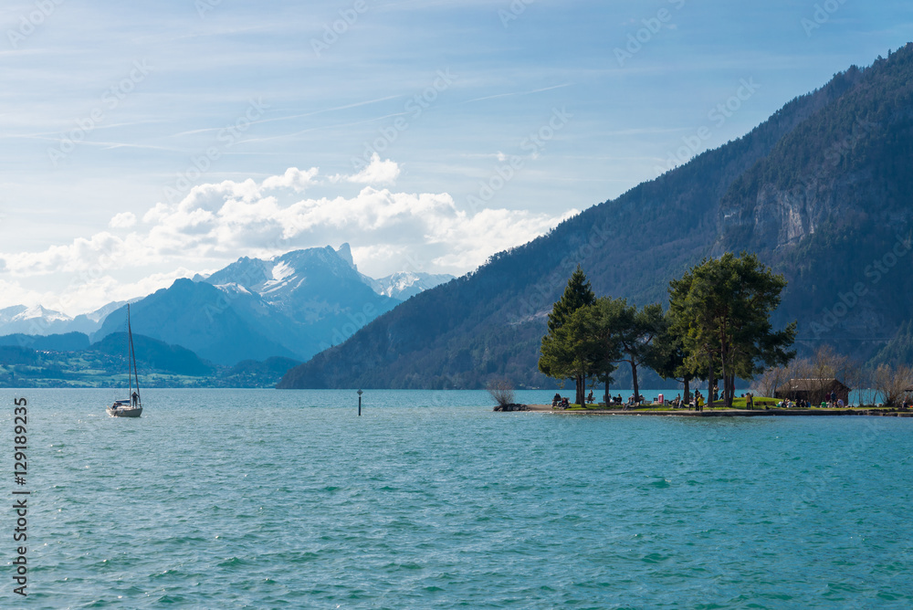 Thunersee lake in Interlaken, Switzerland and Alps range background
