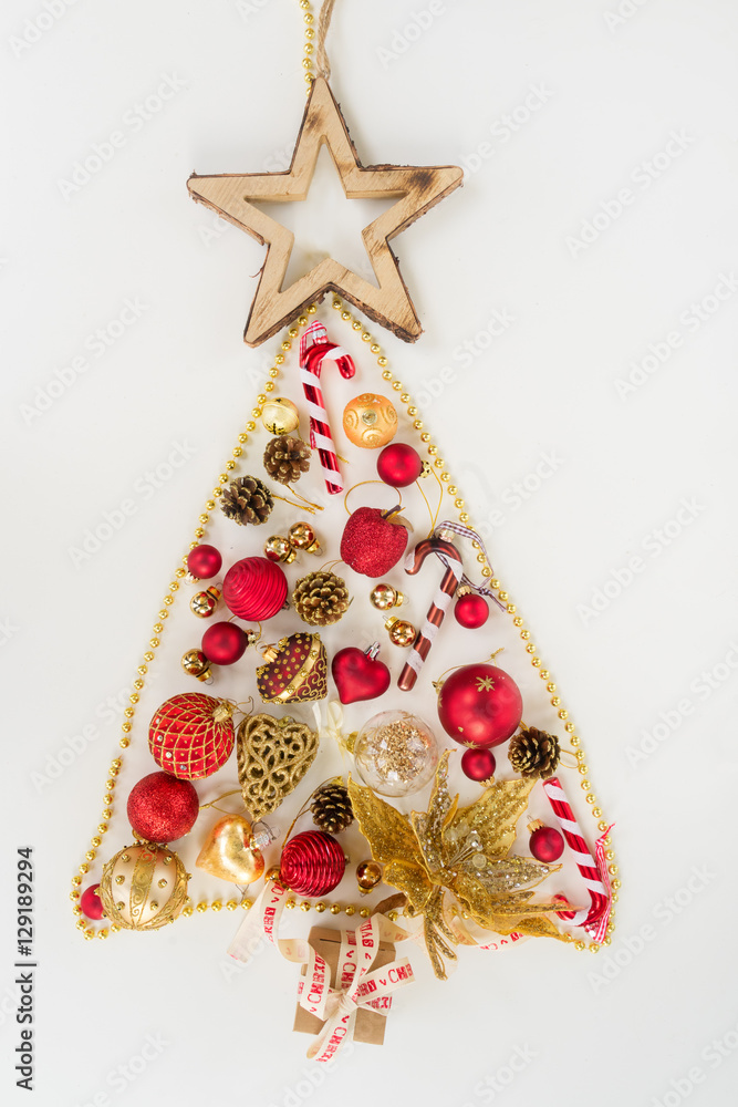 Red and golden hanging christmas tree of a collection of small pieces for decoration