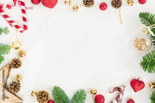 Christmas flat lay styled scene - top view frame with evergreen tree twigs and decorations