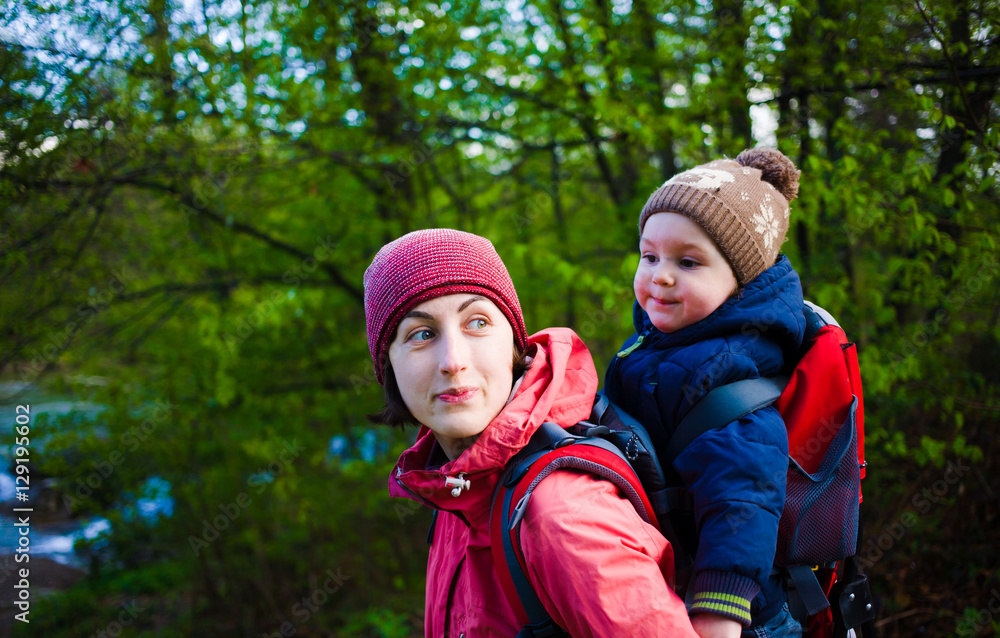 The mother and son are traveling. The mother and son are traveling.