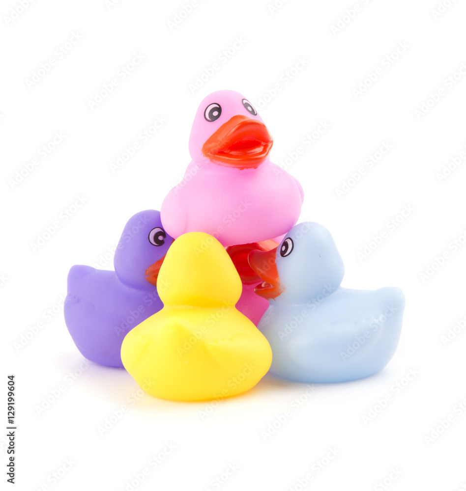 Rubber ducks working together to hold one up - concept of teamwork Rubber ducks working together to hold one up - concept of teamwork