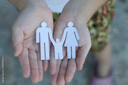 Children hands holding small model of heart and family , concept