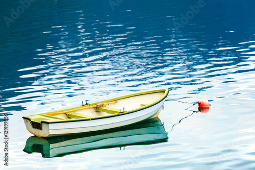 Wall Mural Little boat on water surface