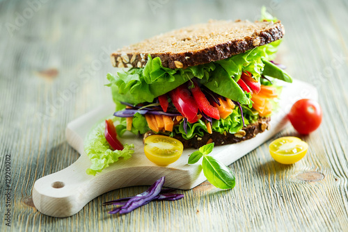 Vegan rye wholegrain fresh sandwich with ingredients for healthy meal, vitamin and diet food photo