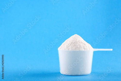 protein powder in a plastic spoon