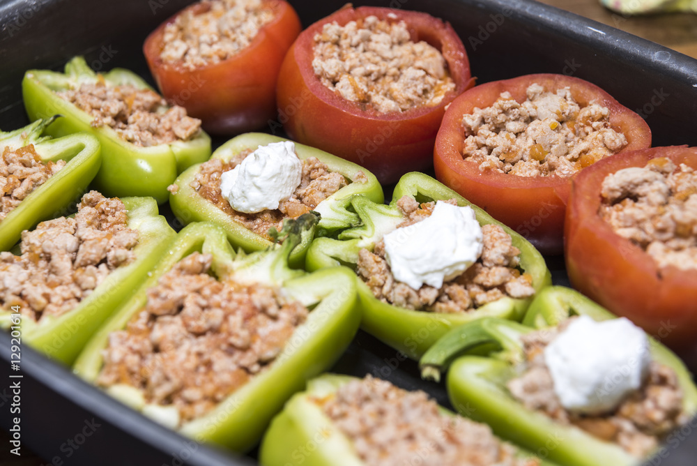 Peppers and tomatoes stuffed with meat