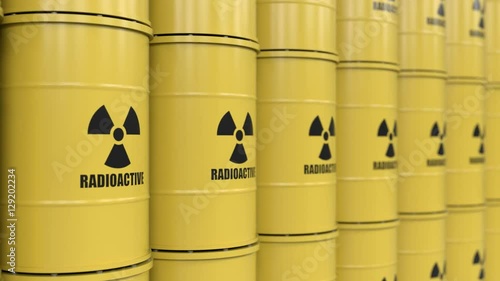 Yellows barrels containing radioactive material. Tracking shot
