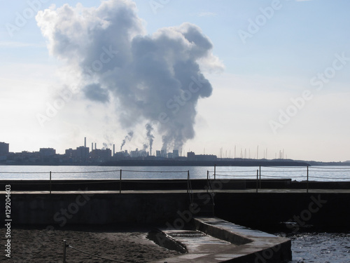 Industrial landscape along the coast. Air polluting factory chimneys © lukeluke68