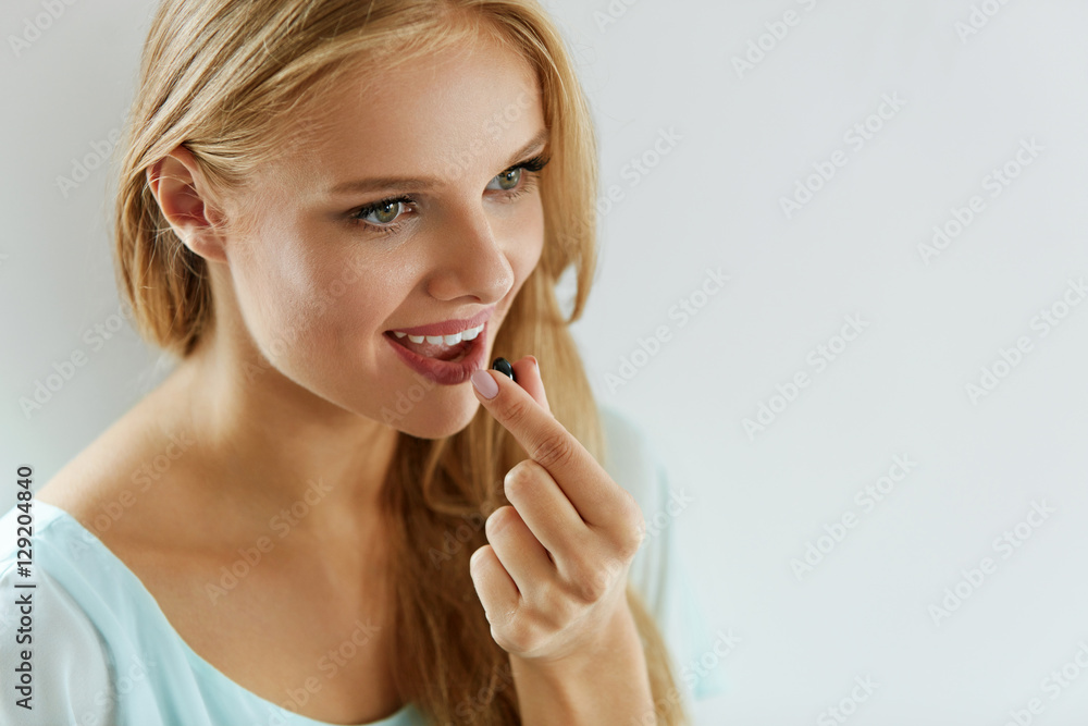Beautiful Woman Taking Pill, Medicine. Vitamins And Supplements Beautiful Woman Taking Pill, Medicine. Vitamins And Supplements
