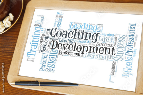 blackboard with coaching and development word cloud