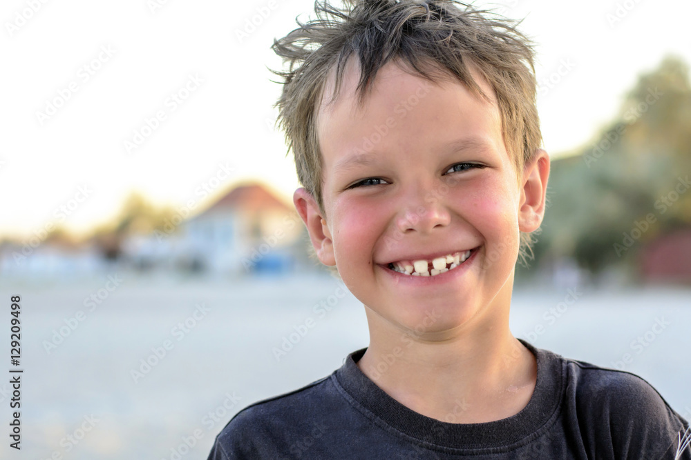 Portrait of a beautiful boy of the European appearance, smiling, happy Portrait of a beautiful boy of the European appearance, smiling, happy