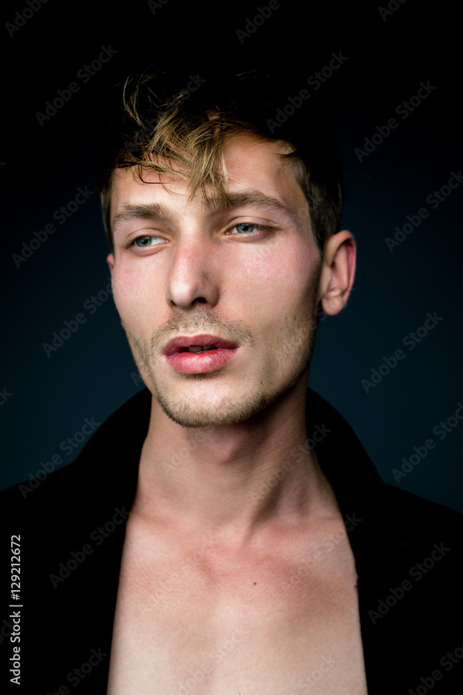 Fototapeta premium handsome young man in black jacket posing in studio