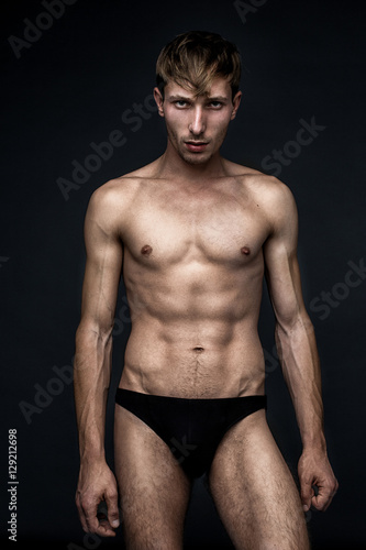 handsome young man in underwear posing in studio
