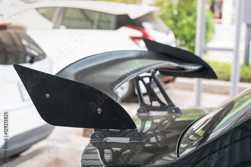 Quadro em tela car part ; Close up detail of a custom racing carbon fiber spoiler on the rear o