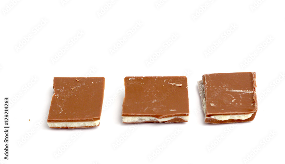 Broken yoghurt chocolate bars on white Broken yoghurt chocolate bars on white