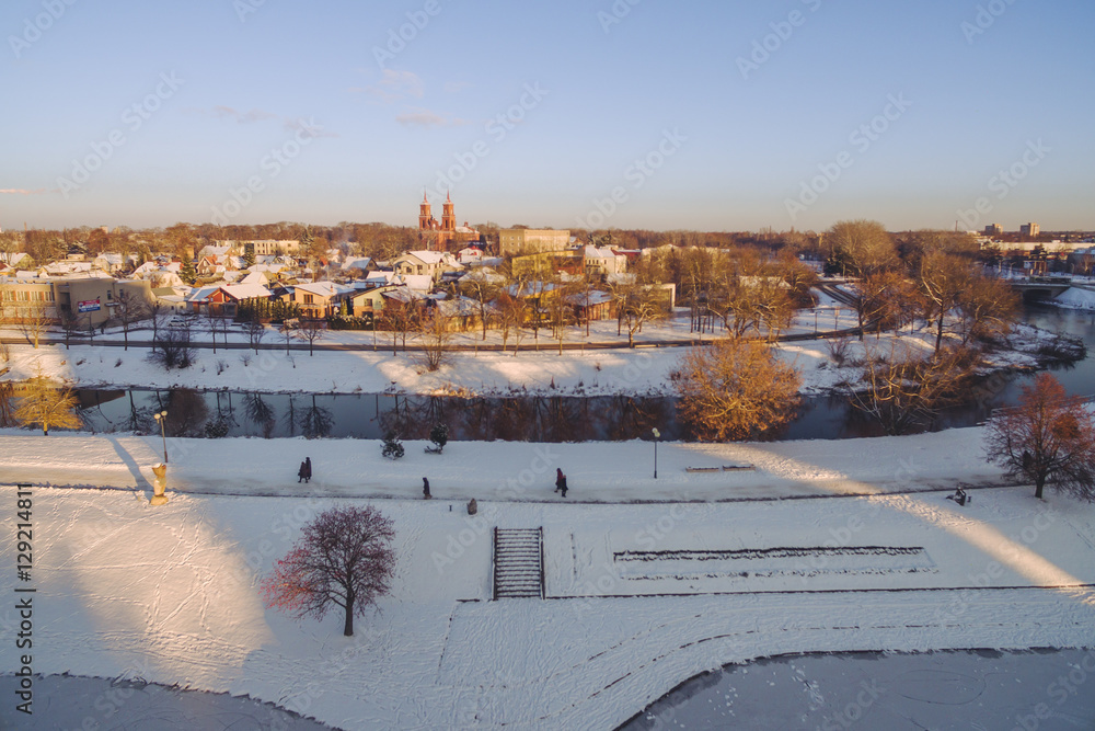 Fototapeta premium Winter sunset in Panevezys city center, Lithuania. Aerial view