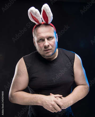 Comic actor with bunny ears, on the eve of Christmas and New Year photo