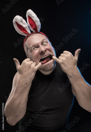 Comic actor with bunny ears, on the eve of Christmas and New Year photo