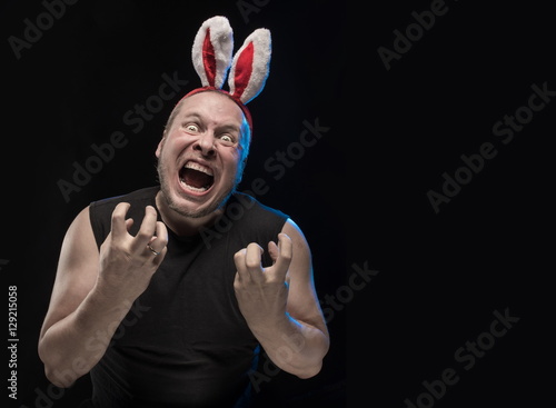 Comic actor with bunny ears, on the eve of Christmas and New Year photo