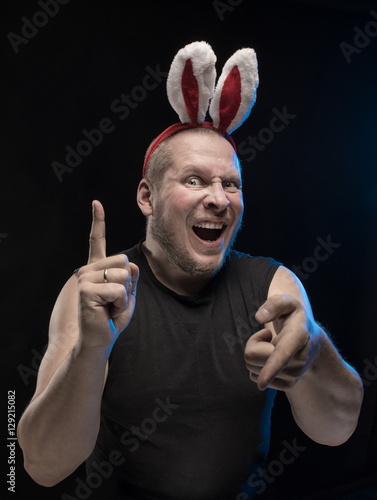 Comic actor with bunny ears, on the eve of Christmas and New Year photo