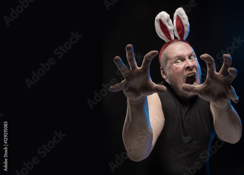 Comic actor with bunny ears, on the eve of Christmas and New Year photo