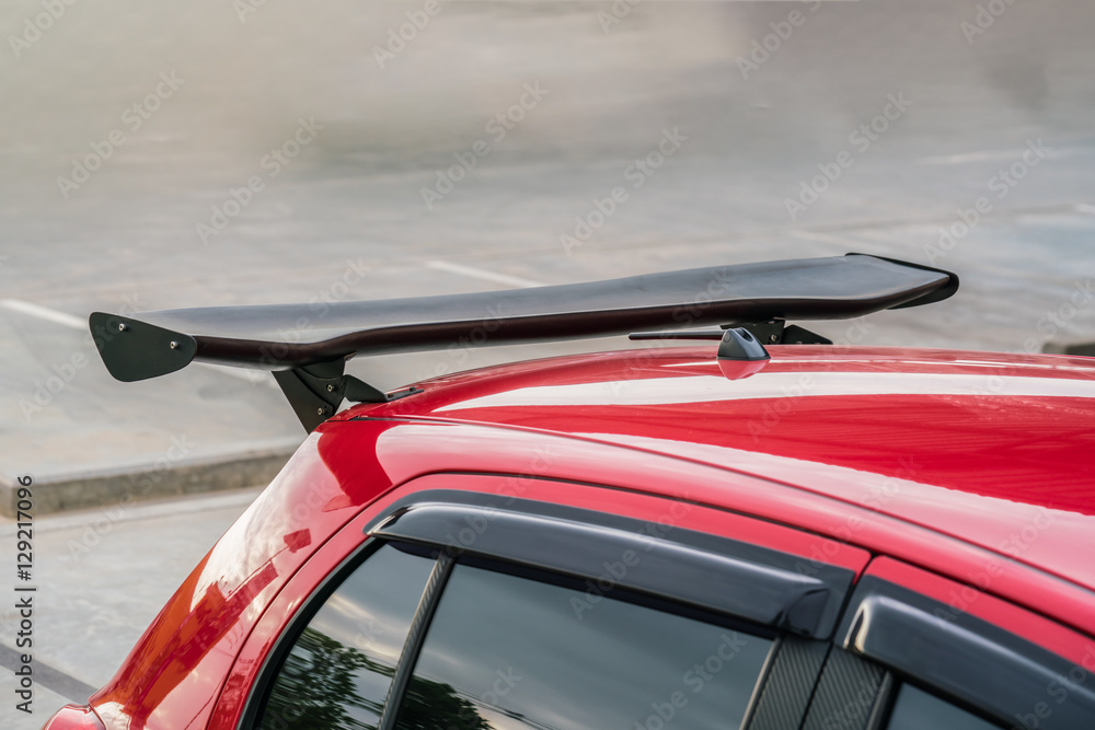 Car part ; Close up detail of a custom racing carbon fiber spoiler on the  rear of a modern car with copy space Photos | Adobe Stock