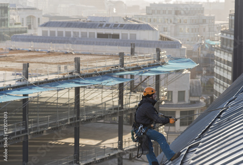 Картината върху платно Industrial abseiler on the rooftop