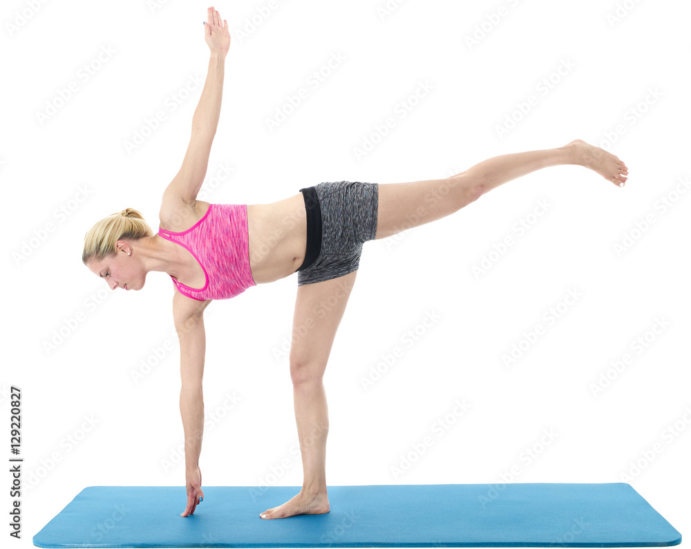 Young woman exercising on mat Young woman exercising on mat